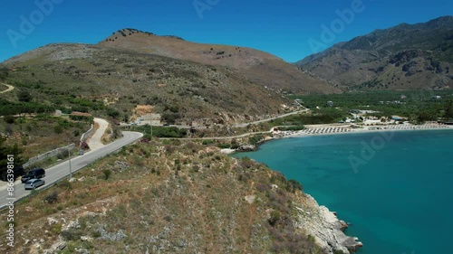 Tourist Summer Destination on Azure Seawater Ionian Coastline of Albania, Calm Beach with White Sand for Relaxing Getaways photo