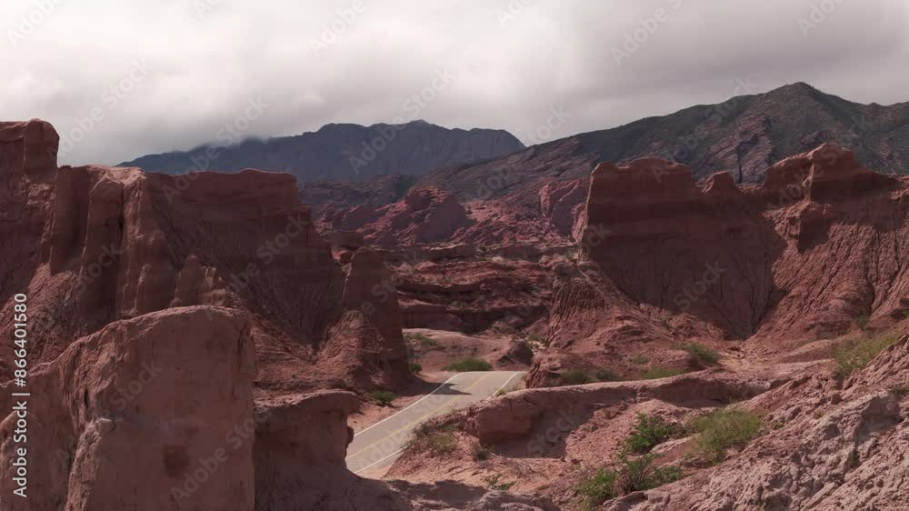 Aerial view of Las Ventanas de Cafayate, Salta Argentina. Route between the rock formations. Drone moving to the right recording with telephoto lens. Aerial view of Las Ventanas de Cafayate, Salta Argentina. Route between the rock formations. Drone moving to the right recording with telephoto lens.