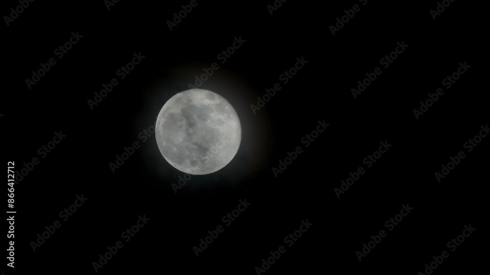 Full moon passing by with clouds in front. Full moon passing by with clouds in front.