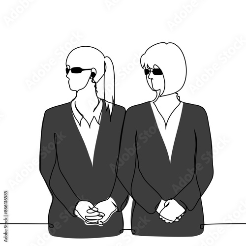 female security guards stand side by side in black suits, sunglasses, they both look to the side - one line art vector. concept strong women, female security, club only for women