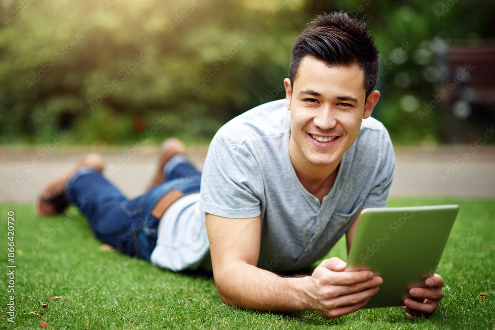 Outdoor, portrait and man on grass with tablet, streaming subscription, playing games and texting on app. Nature, male person and digital for website, networking and chatting on social media in park Outdoor, portrait and man on grass with tablet, streaming subscription, playing games and texting on app. Nature, male person and digital for website, networking and chatting on social media in park