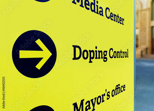 Doping control signpost on street. Direction sign to the laboratory for sports doping testing and control photo