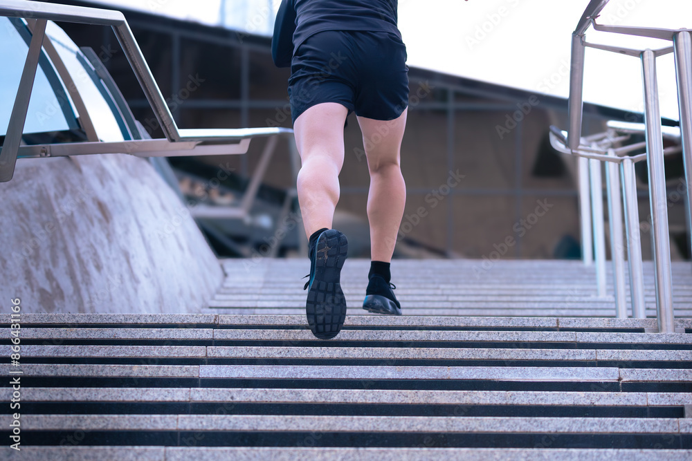 Unrecognizable Athlete, running down the stairs, doing dynamic exercise outdoors Unrecognizable Athlete, running down the stairs, doing dynamic exercise outdoors