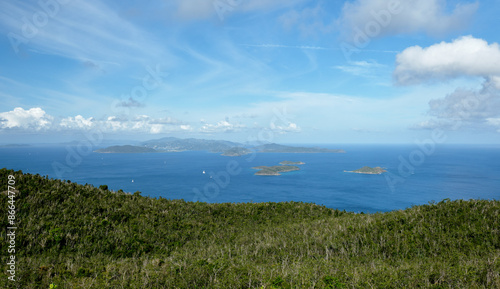 Tortola viewed from Gorda Peak on Virgin Gorda. The smaller islands in the foreground are The Dogs. The lookout tower was rebuilt after Hurricane Irma and reopened in 2023.