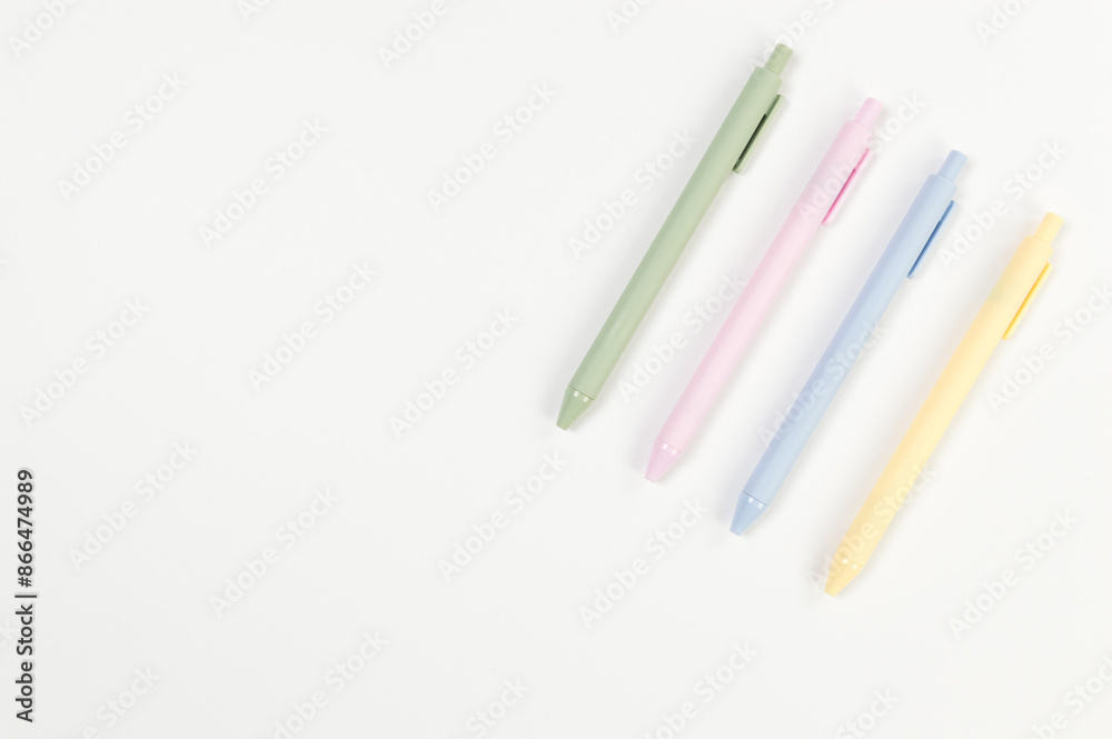 Top view of colorful pens on white background. School, office wallpaper. Flat lay, copy space. Top view of colorful pens on white background. School, office wallpaper. Flat lay, copy space.