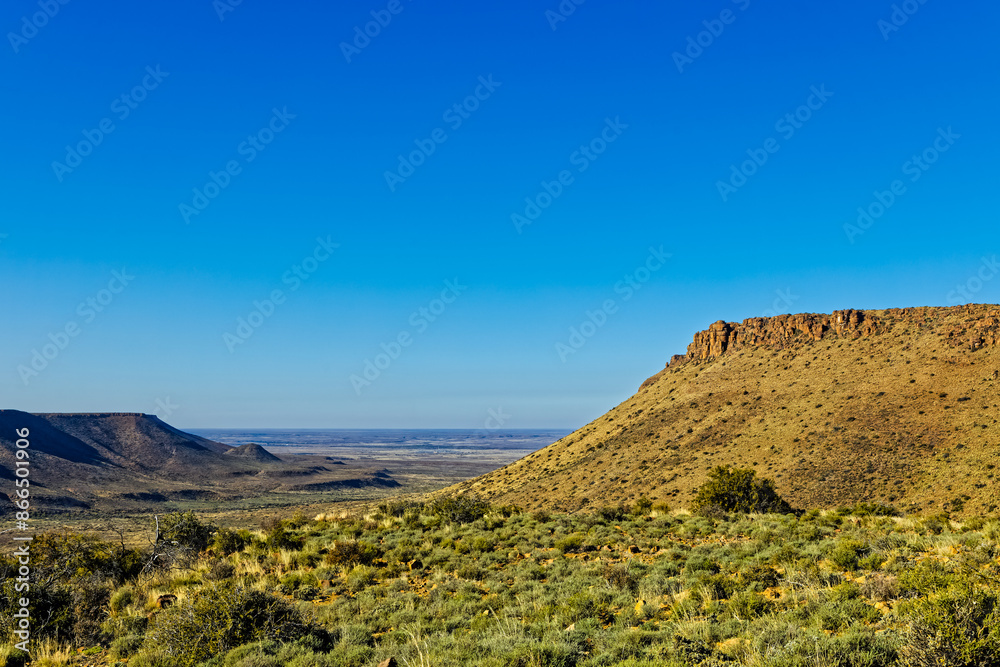 Landscape of flat Karoo mountain with dolerite sill and empty plains in the Karoo National Park, Western Cape, South Africa Landscape of flat Karoo mountain with dolerite sill and empty plains in the Karoo National Park, Western Cape, South Africa