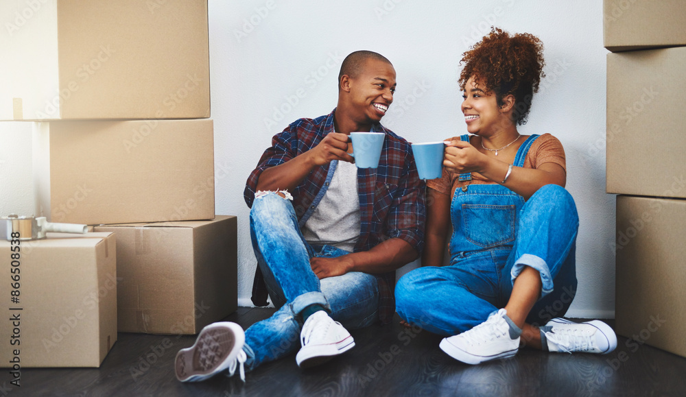 Couple, boxes and new house on floor with coffee in for moving, investment and rental property. People, toast and happy in living room with package for logistics, mortgage and real estate loan Couple, boxes and new house on floor with coffee in for moving, investment and rental property. People, toast and happy in living room with package for logistics, mortgage and real estate loan