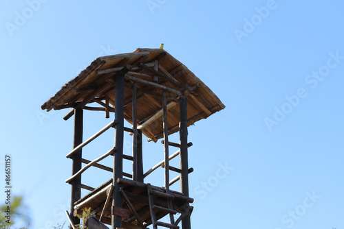 Canvastavla Wooden watchtower with blue sky in the background and copy space