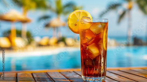 Classic Long Island Iced Tea cocktail served in a tall glass with ice, garnished with a lemon wedge