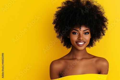 Radiant African American Woman Smiling Against Yellow Background