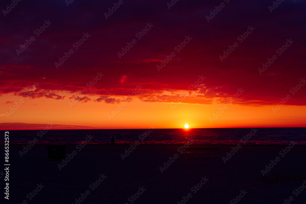 A beautiful sunrise over the Baltic sea - horizon and colorful sky. Natural summer scenery at the Baltic beach in Latvia, Northern Europe. A beautiful sunrise over the Baltic sea - horizon and colorful sky. Natural summer scenery at the Baltic beach in Latvia, Northern Europe.
