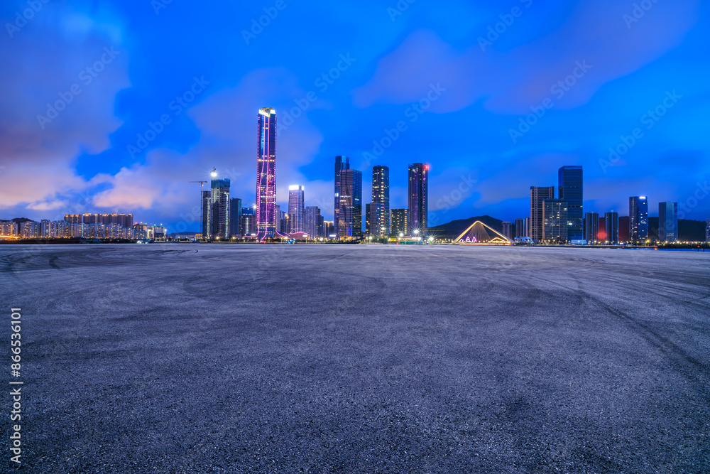 Asphalt road square with modern city buildings scenery at night in Zhuhai. car background. Asphalt road square with modern city buildings scenery at night in Zhuhai. car background.