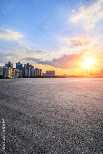 Wallpaper Mural Asphalt road square and city skyline with modern buildings scenery at sunset. car background. Torontodigital.ca