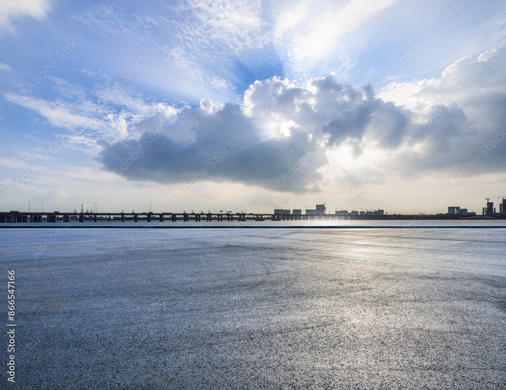 Fototapeta premium Asphalt road square and sky clouds natural landscape. car background.