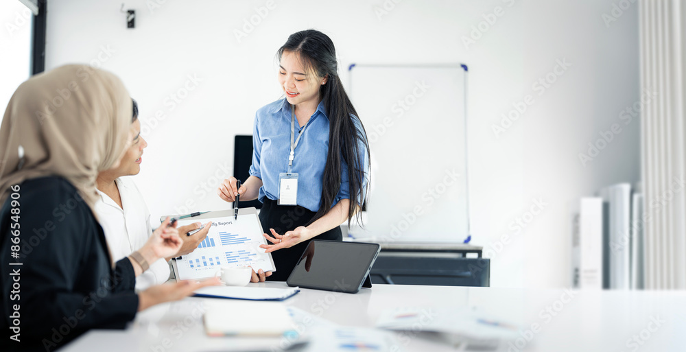 Asian team of business people working with business data analytics on laptop at office, Business presentation or seminar concept. Asian team of business people working with business data analytics on laptop at office, Business presentation or seminar concept.