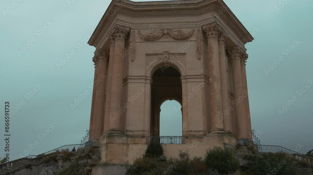 Château d’eau du Peyrou at the Bassin principal du Peyrou. The water building and pond at the promenade du Peyrou - Montpellier, France Château d’eau du Peyrou at the Bassin principal du Peyrou. The water building and pond at the promenade du Peyrou - Montpellier, France