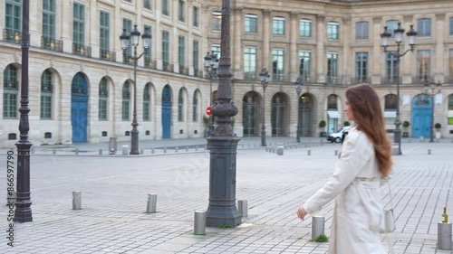 Paris, France Place Vendome girl is walking around photo