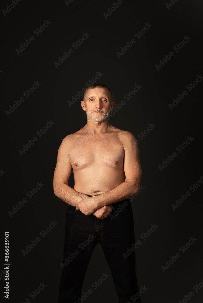 elderly man with a beard, a handsome torso and in good physical shape. Healthy lifestyle. Selective focus elderly man with a beard, a handsome torso and in good physical shape. Healthy lifestyle. Selective focus
