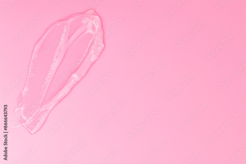 Gel smears cosmetic texture on pink background with space for text
