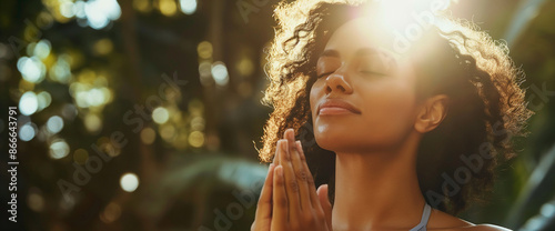 Black woman doing yoga pranamasana prayer pose