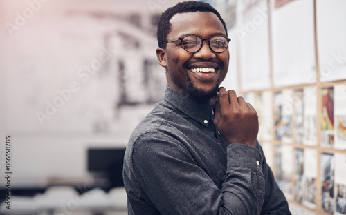 Smile, glasses and portrait of architect in office with information on pinboard at startup. Happy, pride and professional black man with career in architecture working on industrial design project.