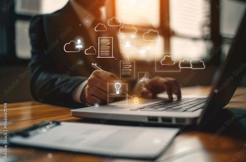 Businessman Working on Laptop with Cloud Computing Icons Businessman Working on Laptop with Cloud Computing Icons