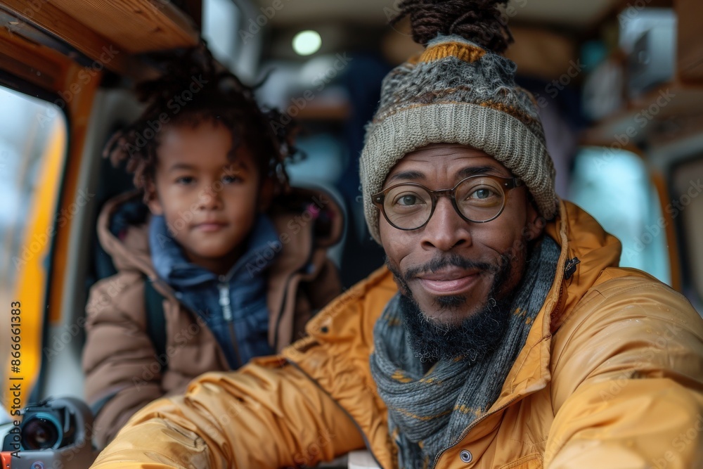 A father in a yellow jacket and beanie shares a bonding moment with his young son in cozy winter clothing inside a vehicle, evoking themes of warmth, connection, and comfort. A father in a yellow jacket and beanie shares a bonding moment with his young son in cozy winter clothing inside a vehicle, evoking themes of warmth, connection, and comfort.