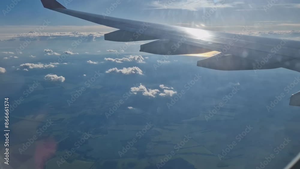 The view from the window of an air plane to the clouds, blue sunny sky. The view from the window of an air plane to the clouds, blue sunny sky.