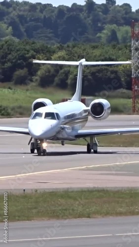 Generic Airplane Turning and Taxiing on the tarmac of airport unmarked white photo