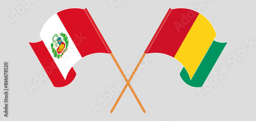 Crossed and waving flags of Peru and Guinea