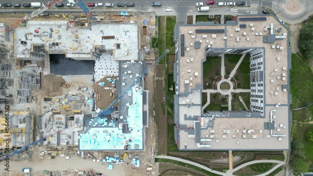 Aerial view of construction site with crane and building. Top view of big development construction and architecture Aerial view of construction site with crane and building. Top view of big development construction and architecture
