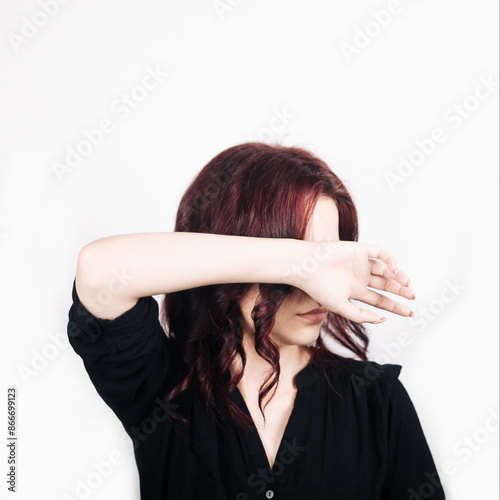 Female portrait. Curly hair. White background. Emotions