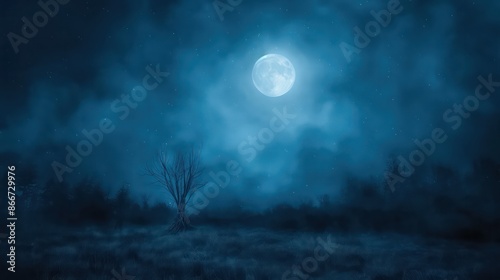 A large moon is shining brightly in the sky above a field of grass. The scene is dark and quiet, with only the moon and the trees visible photo