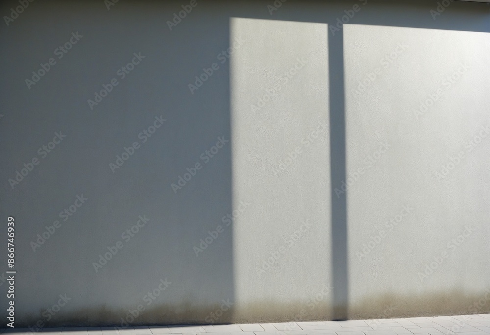 Fototapeta premium A geometric composition of black-and-white shadows overlaid on a smooth concrete wall surface