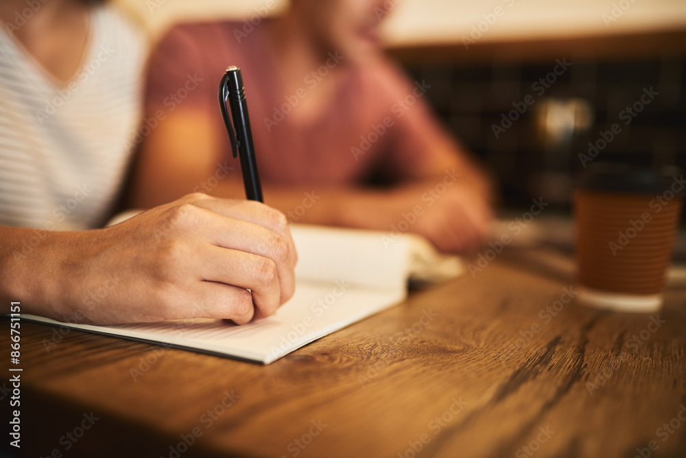 Book, pen and person writing notes for college research studying for project, assignment or test. Education, hand and student by desk with information for university scholarship entrance exam. Book, pen and person writing notes for college research studying for project, assignment or test. Education, hand and student by desk with information for university scholarship entrance exam.