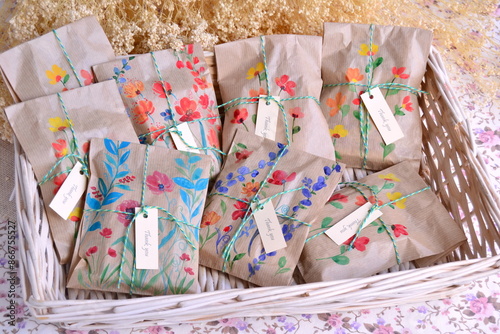 Fotografie Wedding favors original packaging craft paper bags with hand painted watercolor