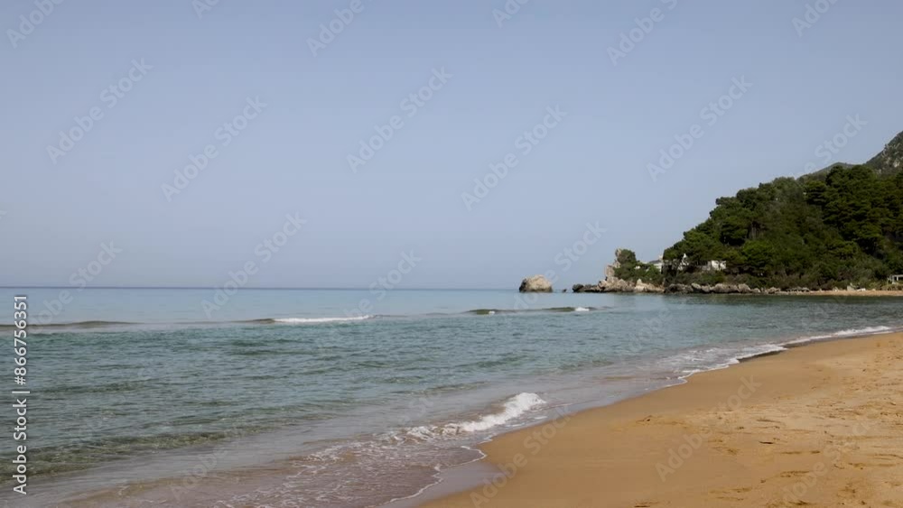 Corfu Greece beautiful sandy beach waves. Greek island the Ionian Sea of Greece. Greek mythology, temples, medieval castles, forts and buildings. Hot summer Mediterranean climate. Corfu Greece beautiful sandy beach waves. Greek island the Ionian Sea of Greece. Greek mythology, temples, medieval castles, forts and buildings. Hot summer Mediterranean climate.