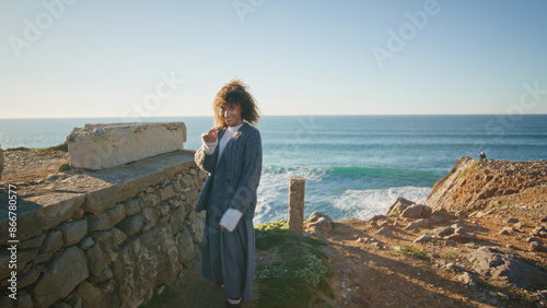 Casual woman going ocean mountain. Serene girl looking camera enjoying weekend