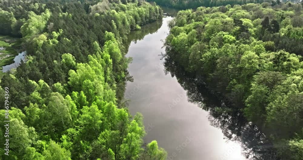 Small winding river by the forests at spring. Small winding river by the forests at spring.