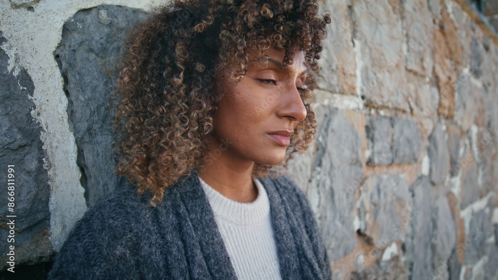 Upset woman thinking wall at autumn nature closeup. Girl enjoying light wind