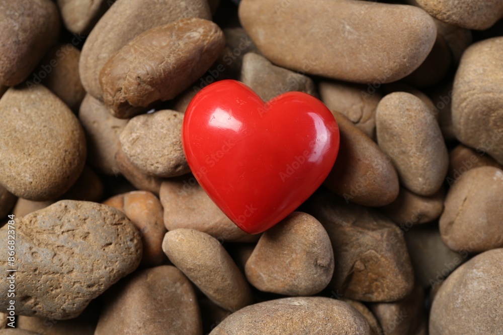 Red decorative heart on stones, above view Red decorative heart on stones, above view