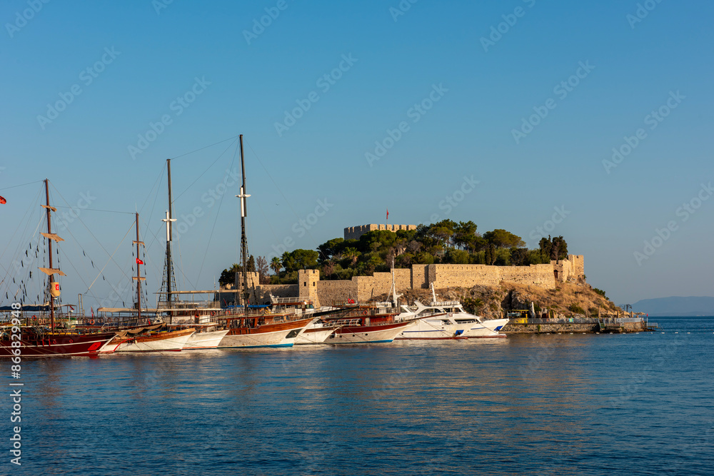 Naklejka premium Guvercinada Island (Pigeon Island) and Guvercinada Castle in Kusadasi. Aydin, Turkey. Kusadasi is a popular tourist destination in Turkey.