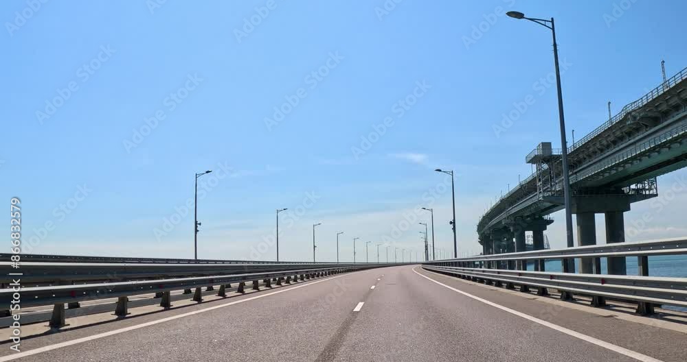 POV of a car windshield while driving on a bridge. POV of a car windshield while driving on a bridge.