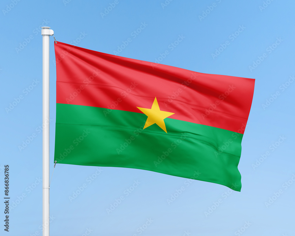 Fototapeta premium Burkina Faso flag on stick on sky background. Realistic flag illustration