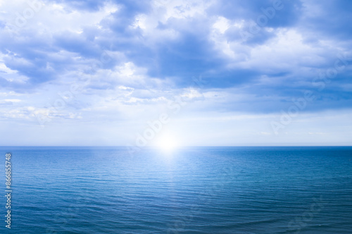 Wallpaper Mural Calm windless ocean with the sun on the horizon. Torontodigital.ca