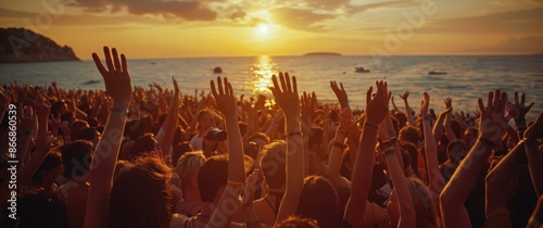 Crowd Celebrates at Beach During Golden Hour Sunset