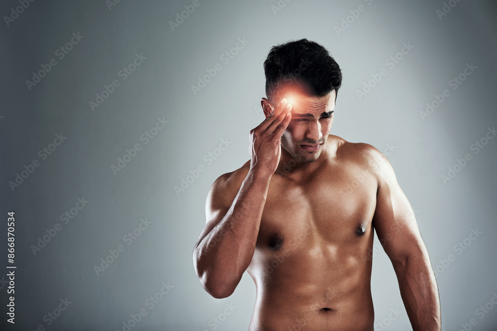 Fototapeta premium Man, bodybuilder and headache in studio with space for mockup, fatigue and training for health by white background. Person, migraine and red glow for pain, tired and burnout from workout for fitness