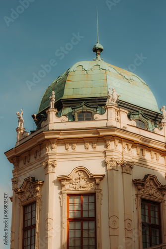 Photography baroque copper dome, topped with a spire, crowns a historic building in Vienna, Austria
