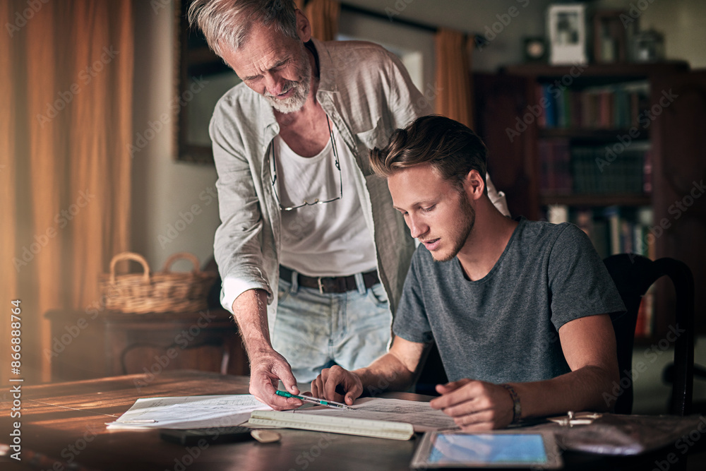 Senior man, architect student and blueprint with learning for education, knowledge and study in home. Elderly dad, son and floor plan for architecture with family business, entrepreneur and teamwork Senior man, architect student and blueprint with learning for education, knowledge and study in home. Elderly dad, son and floor plan for architecture with family business, entrepreneur and teamwork