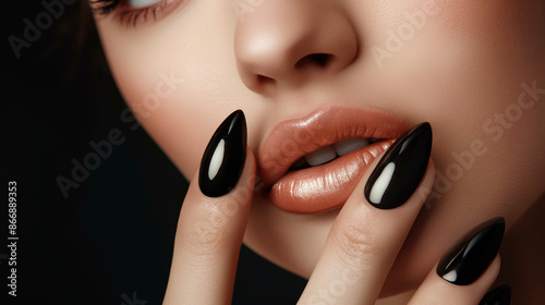 Beautiful girl showing black  manicure nails . makeup and cosmetics